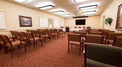 Bright interior room with chairs arranged for an event