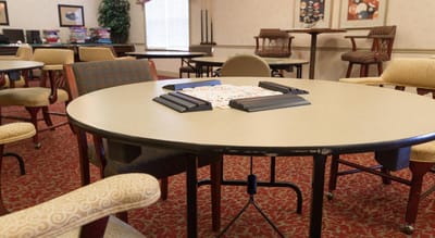Common area with tables and chairs set up