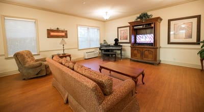 Common area with residents and a piano