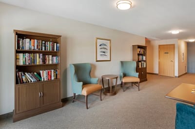 Interior common area with bookshelves and seating
