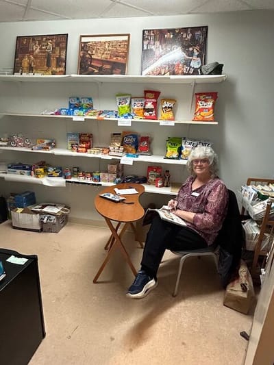 Resident enjoying snacks in a small indoor room