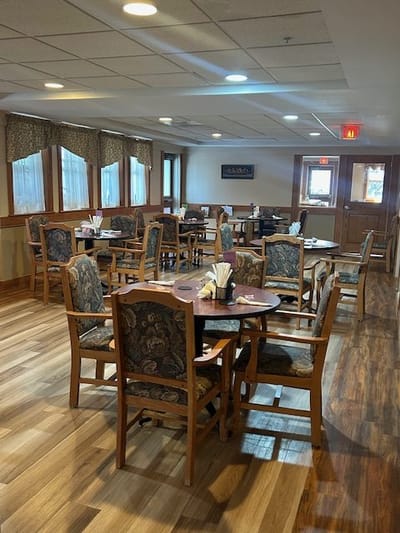Dining area with wooden tables and chairs