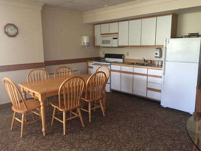A cozy dining area in a retirement community apartment