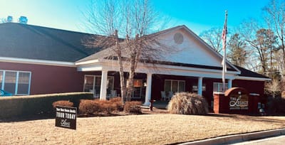 Front entrance of a senior living facility with outdoor signage