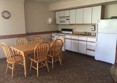 Interior kitchen area with a dining table and chairs
