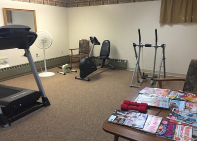 A well-equipped exercise room with fitness equipment