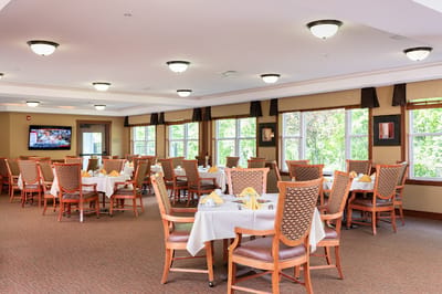 Bright dining room with tables set for dining