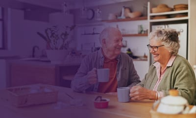 Seniors enjoying coffee in a cozy kitchen