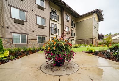 Outdoor view of the facility's garden and building