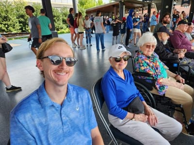 Residents enjoying an outdoor activity with staff