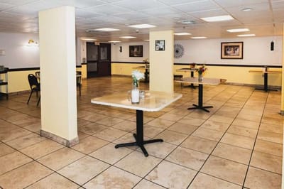 Interior view of a dining area with tables and chairs