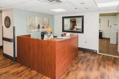 Reception area with staff member at desk