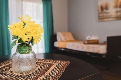 Interior view of a resident room with yellow flowers