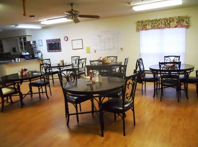Dining room with tables and chairs set up for meals