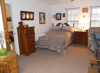 Cozy resident room with a bed and furniture