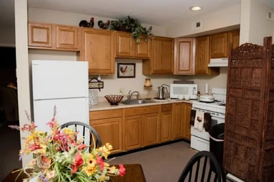 Bright kitchen area with wooden cabinets and decor