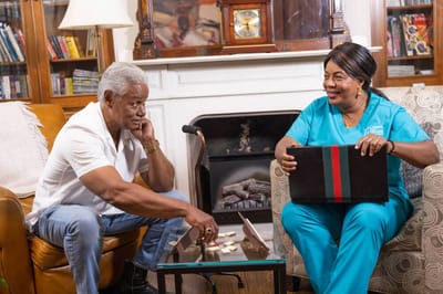 Two residents engaged in a board game activity.