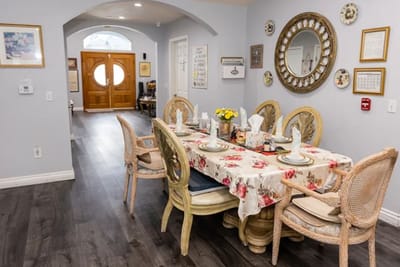 Dining table set with decorative flowers in a facility interior