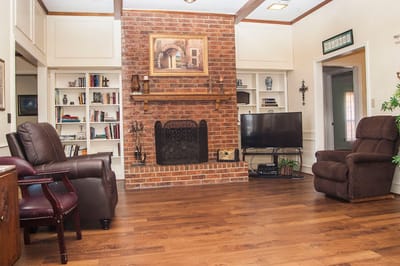 Cozy common area with seating and a fireplace