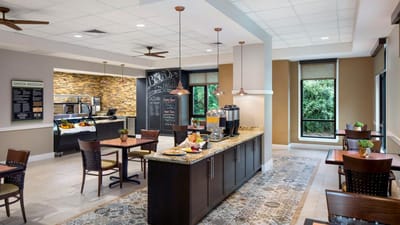 Bright dining area with tables and food service