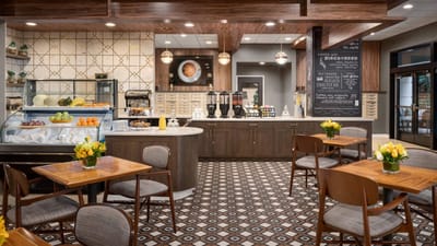 Dining area with tables and a coffee station