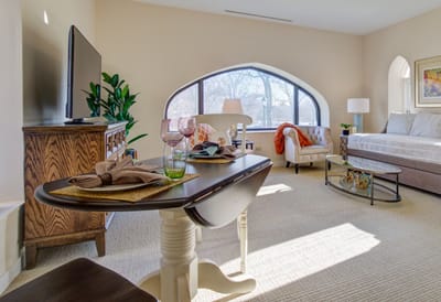 Bright common area with modern furnishings and large windows