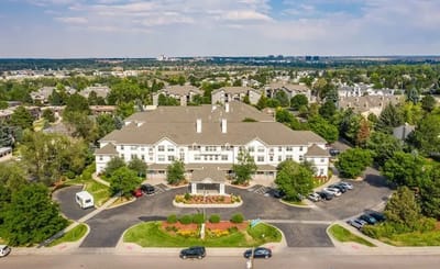 Aerial view of an assisted living facility with gardens
