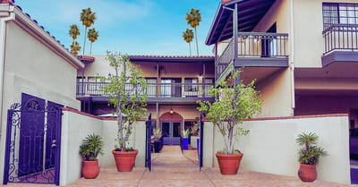 Entrance of a senior living facility with outdoor plants