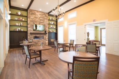 Bright and modern common area with tables and chairs