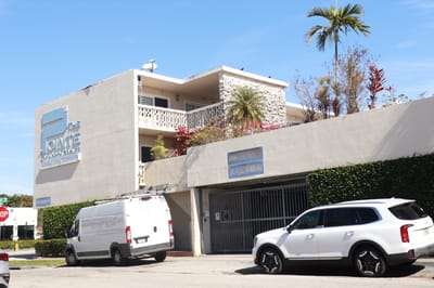 Exterior view of The Pointe of North Gables facility