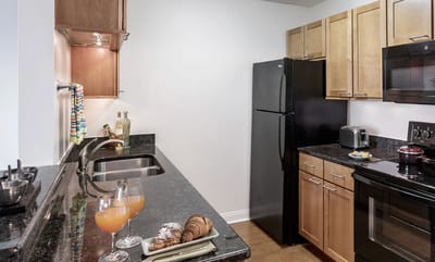 A clean kitchen space with snacks and drinks