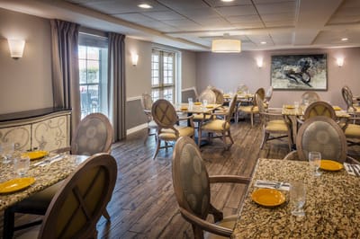Bright dining room with tables set for meals
