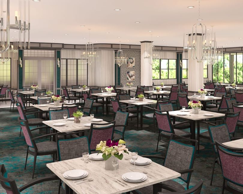 Bright dining room with tables set for meals