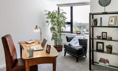 Cozy resident room with a desk and chair