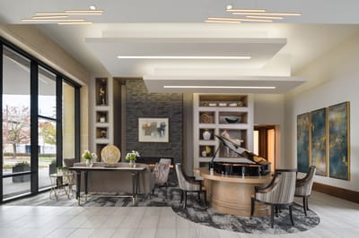 Elegant interior lobby with a grand piano and seating area