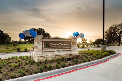 Sign of Spring Cypress Senior Living at sunset