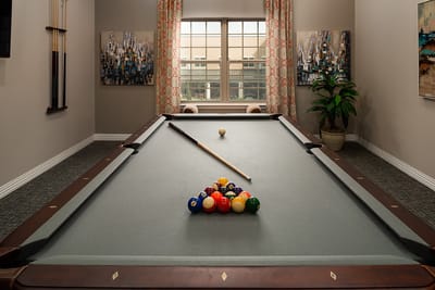 Interior view of a billiards table set up for play