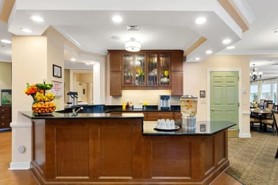 Bright common area with a kitchen and dining setup