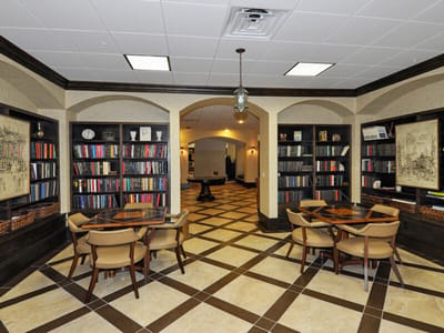 Bright common area with bookshelves and seating
