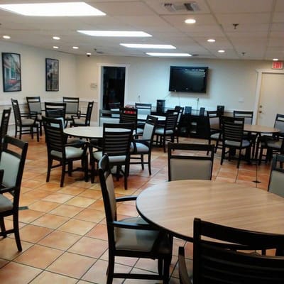 Interior view of a dining room with tables and chairs