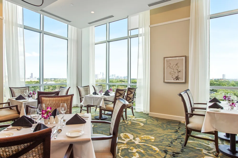 Elegant dining room with tables set for a meal
