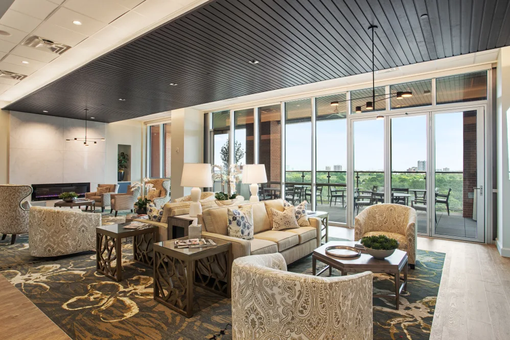 Bright common area with comfortable seating and large windows