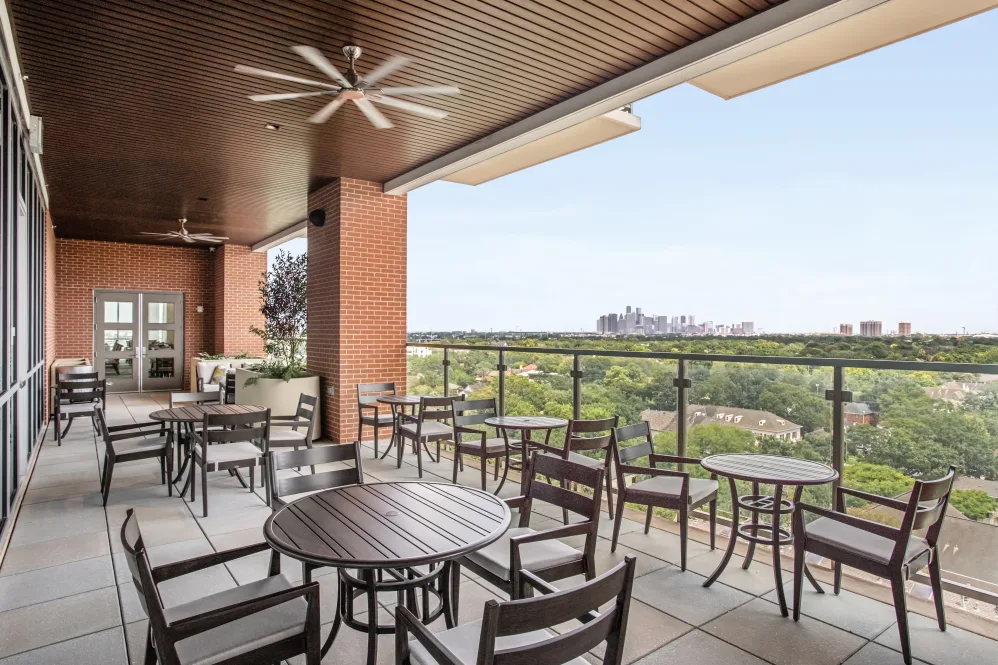 Outdoor terrace with seating and views of the city