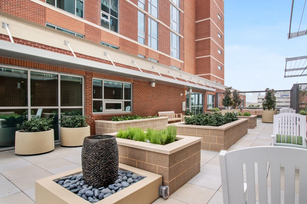 Outdoor patio area with seating and planters