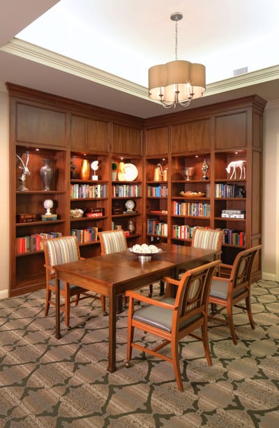 A cozy common area with bookshelves and seating