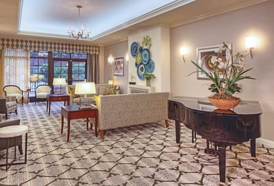 Beautiful lounge area with seating and piano
