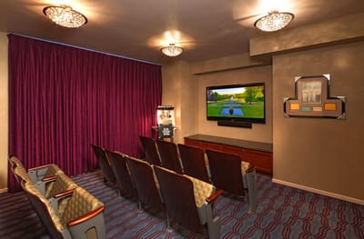 An interior room featuring seating and a TV for entertainment