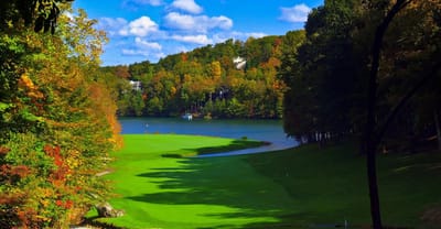 Scenic view of a lake surrounded by autumn foliage