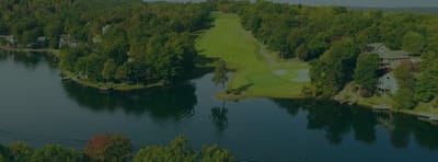 Aerial view of a lush green landscape with water