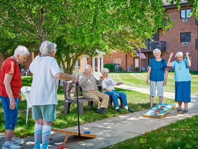 Residents enjoying an outdoor game in the courtyard